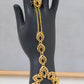 Gold-Plated Hand Chain Bracelet with Ring – Intricate Leaf Design – Elegant Arabic Jewelry for Women