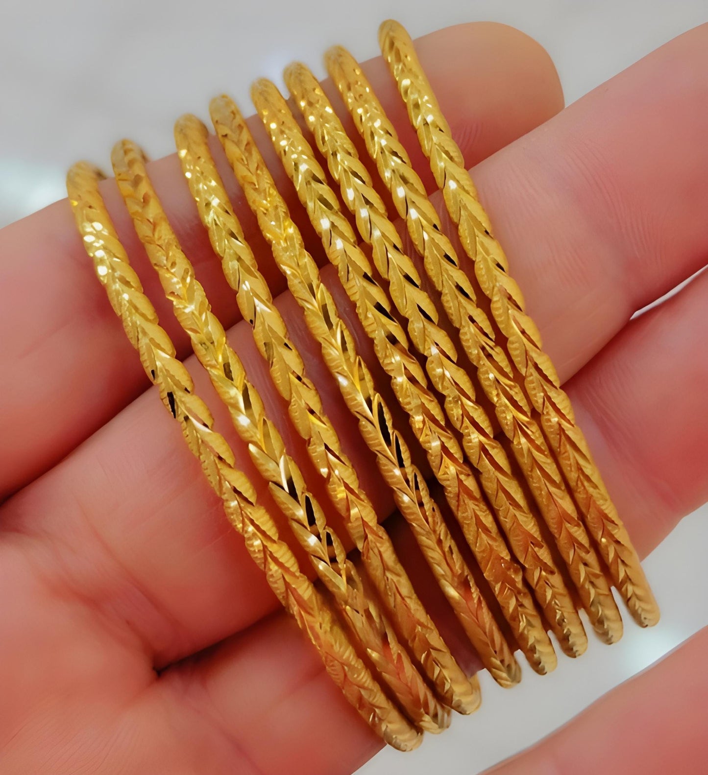7 Gold-Plated Bangles Set – 7 -Piece Stackable Bracelets with Elegant Leaf Design